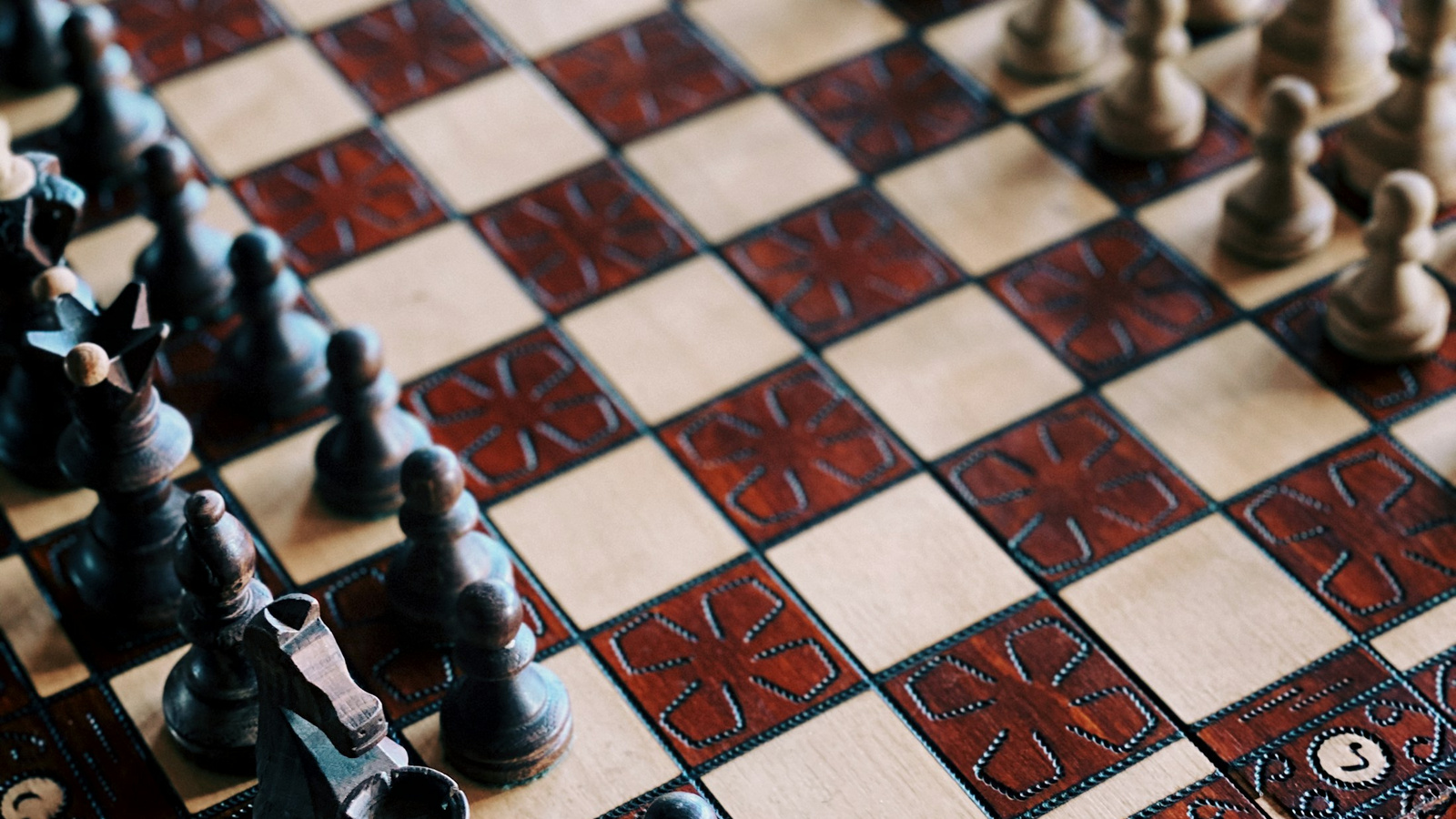 Chess pieces arranged on a board.